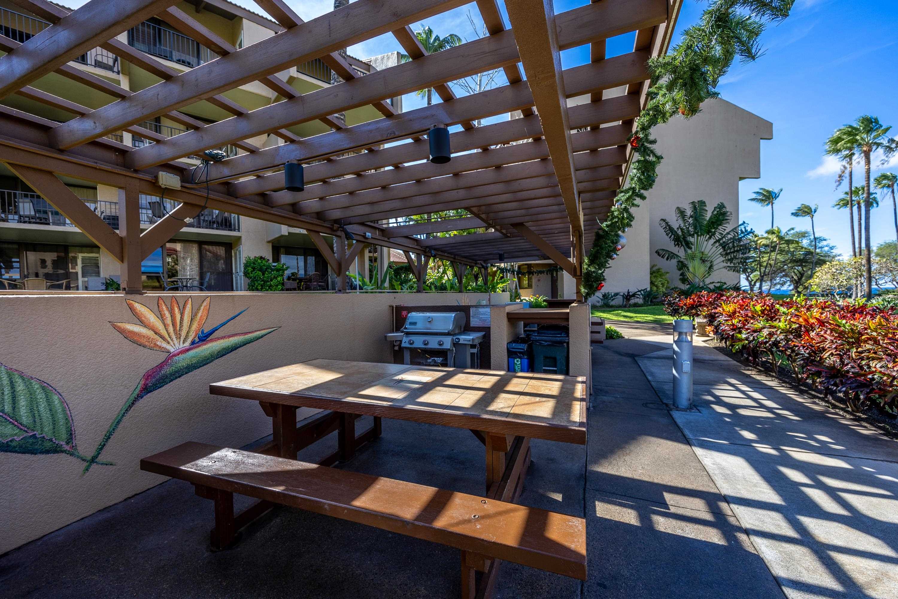 2695 South Kihei Road, Unit 9209 Kihei, HI 96753 - Photo 29 of 50 a view of a chairs and table in a patio