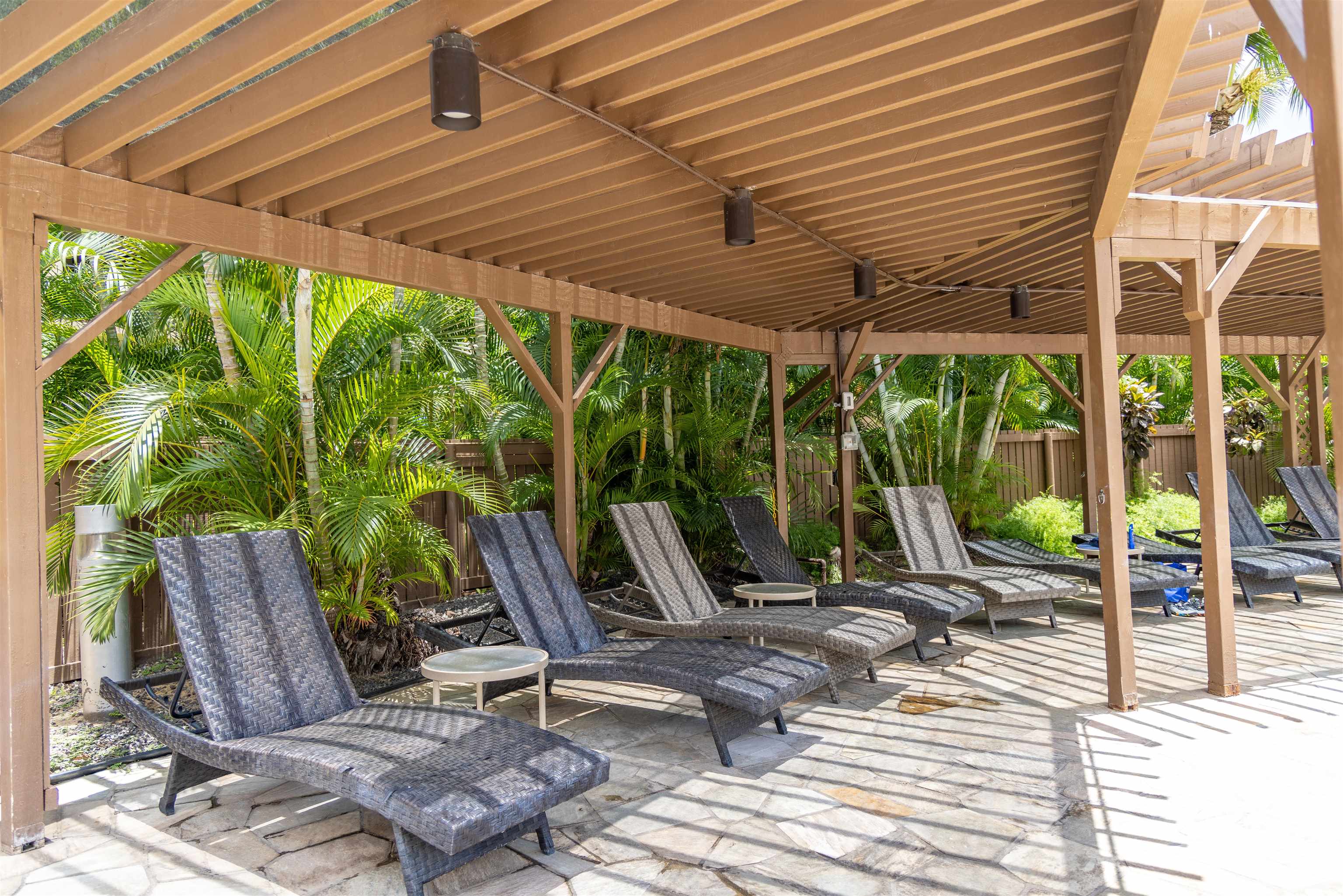 2695 South Kihei Road, Unit 9209 Kihei, HI 96753 - Photo 36 of 50 a view of a patio with table and chairs and wooden floor
