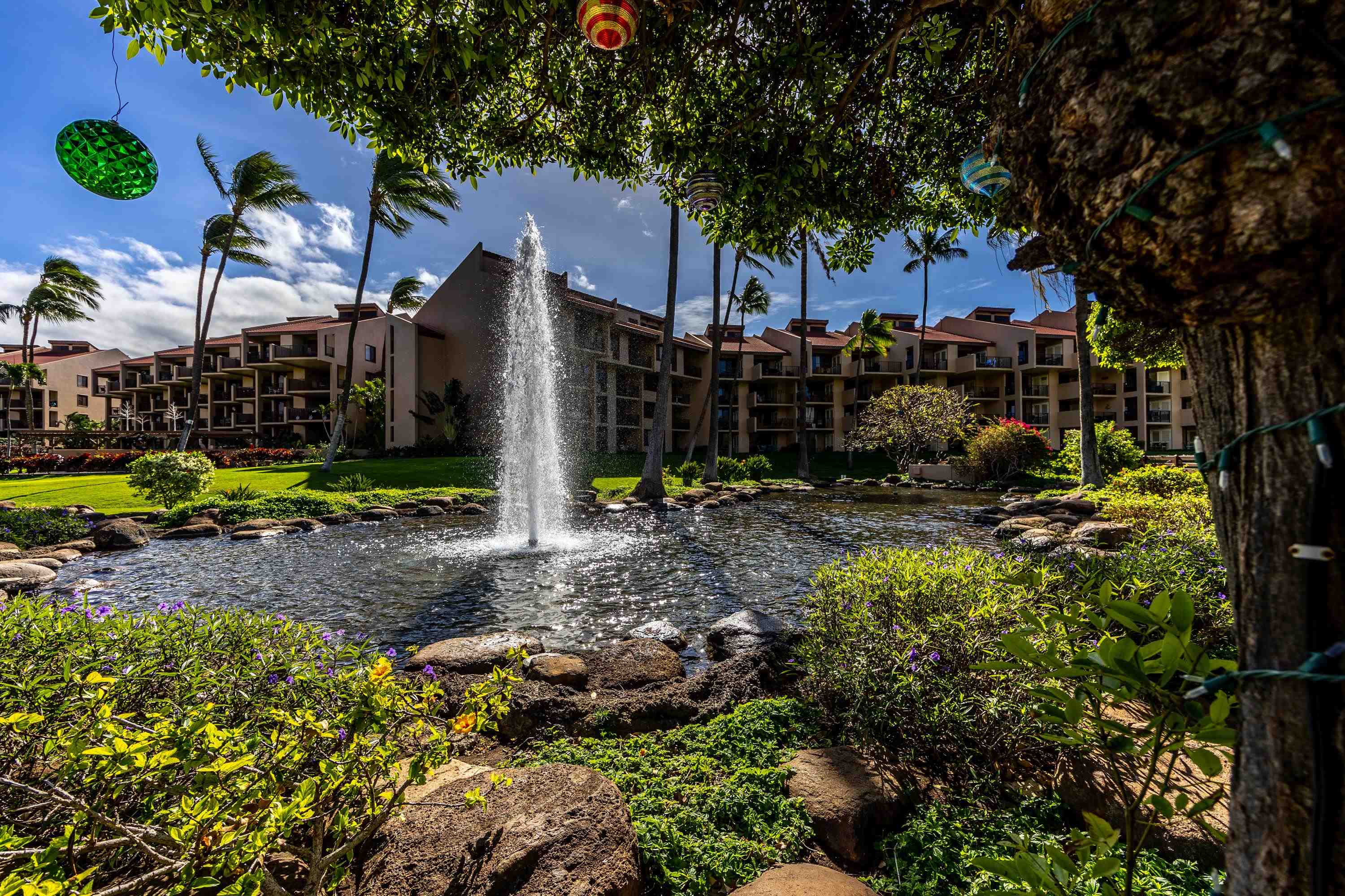 2695 South Kihei Road, Unit 9209 Kihei, HI 96753 - Photo 4 of 50 a view of a park with plants and a bench