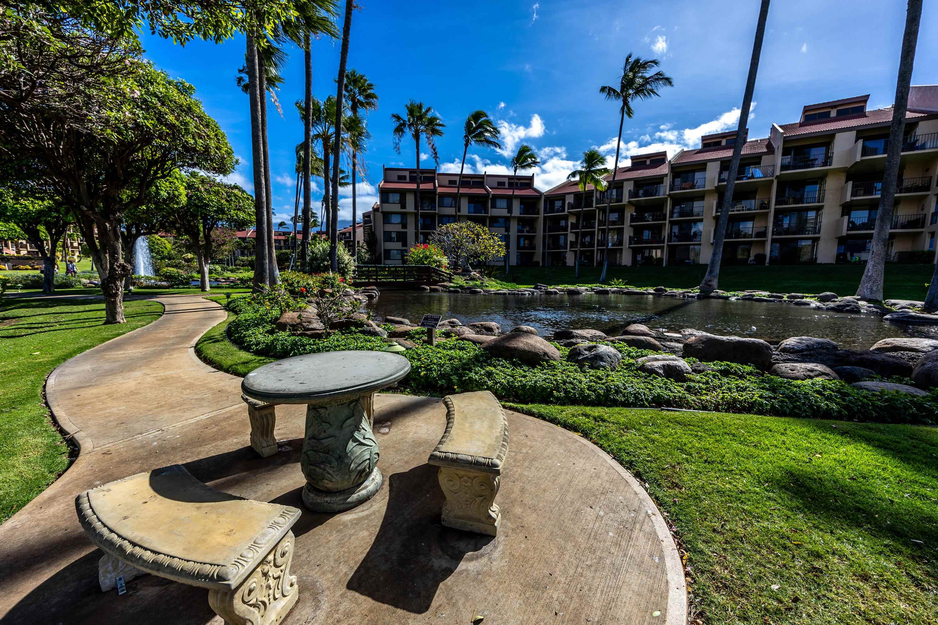 2695 South Kihei Road, Unit 9209 Kihei, HI 96753 - Photo 49 of 50 a view of a chairs and table in backyard