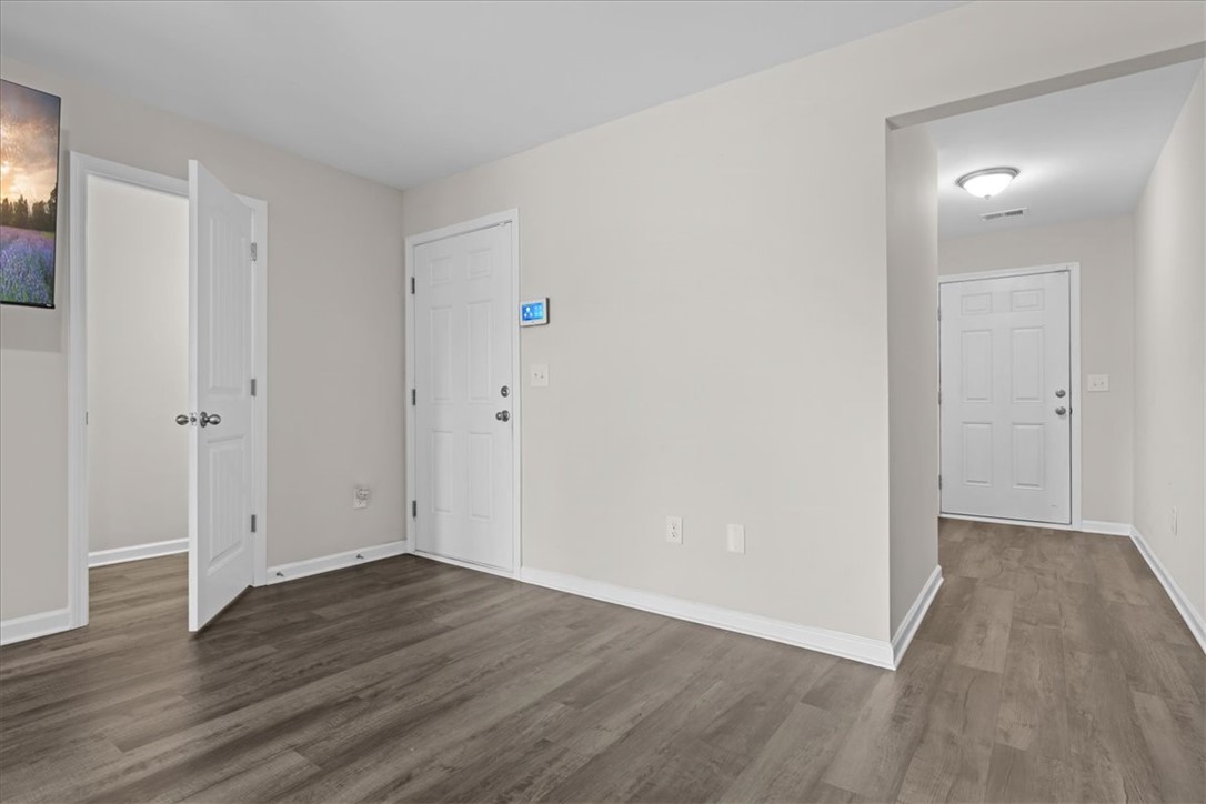 115 Adger Road Pendleton, SC 29670 - Photo 6 of 36 Hardwood-style flooring extends through this welcoming interior, leading to multiple bright entryways.
