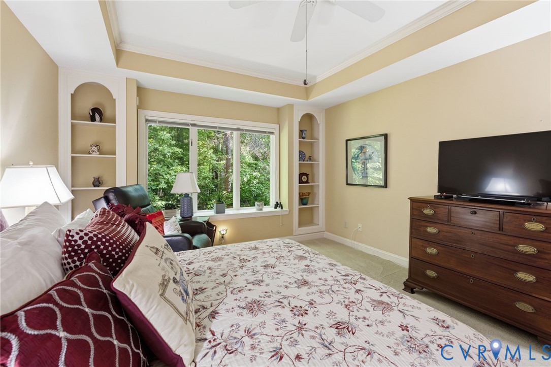 3137 Stony Point Road, Unit D Richmond, VA 23235 - Photo 23 of 31 Primary bedroom has arched alcove bookcases and tr