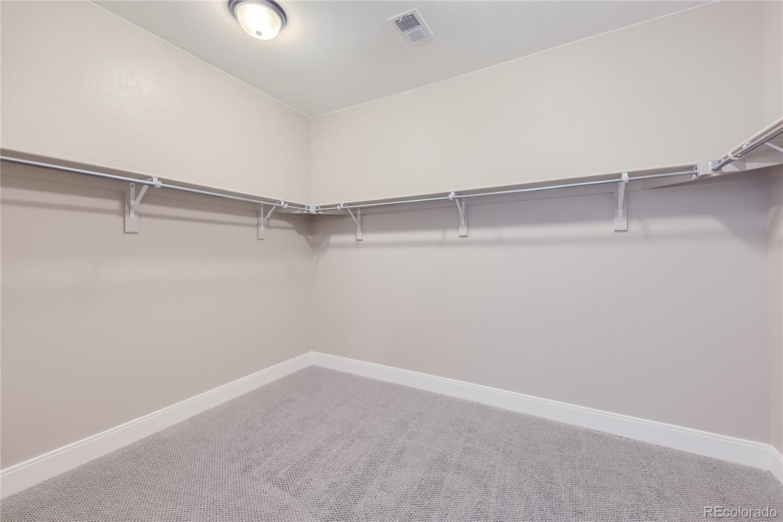 12864 Pinnacle Firestone, CO 80504 - Photo 14 of 29 a view of a room with racks on the wall