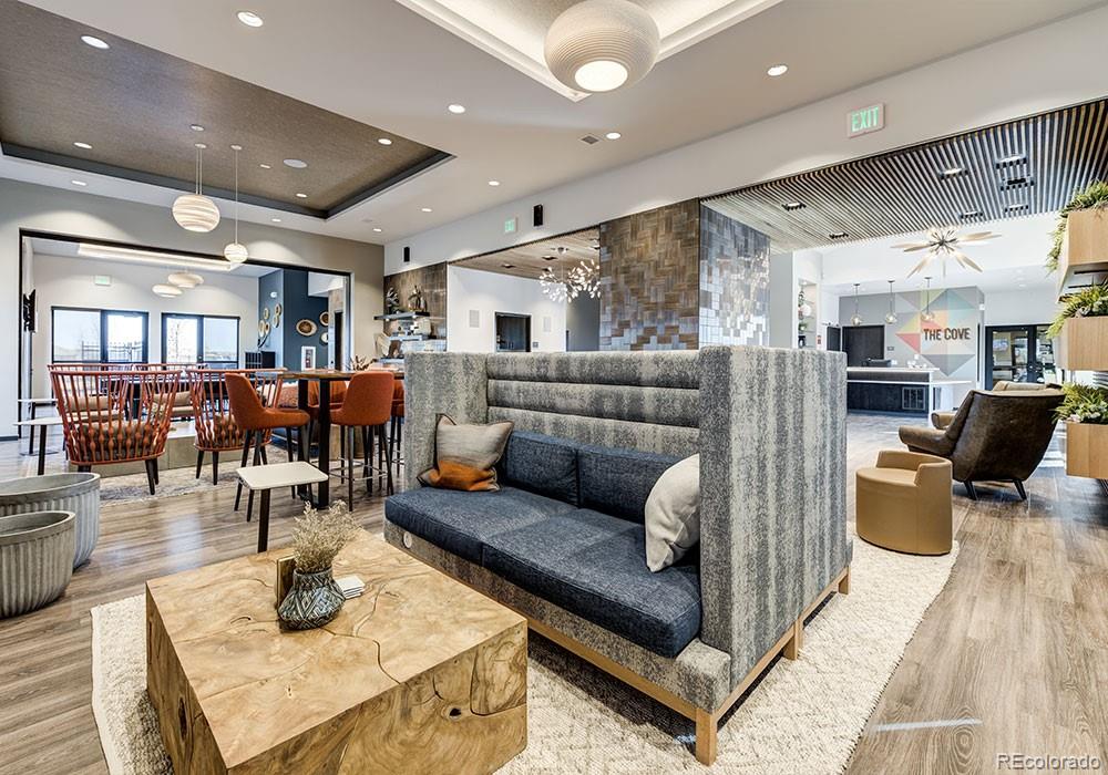 12864 Pinnacle Firestone, CO 80504 - Photo 18 of 29 a living room with furniture and a table