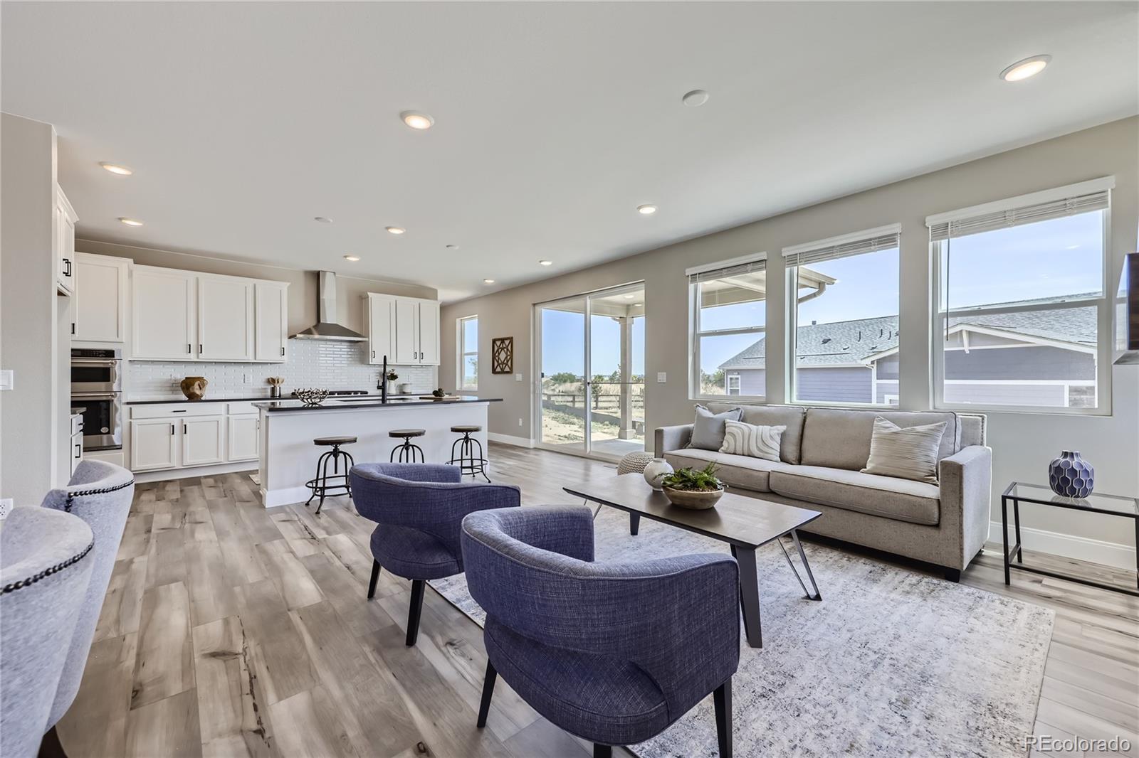 12864 Pinnacle Firestone, CO 80504 - Photo 5 of 29 a living room with furniture and a large window