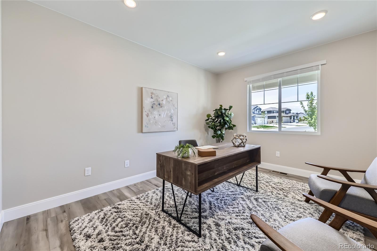 12864 Pinnacle Firestone, CO 80504 - Photo 7 of 29 a living room with furniture and a window