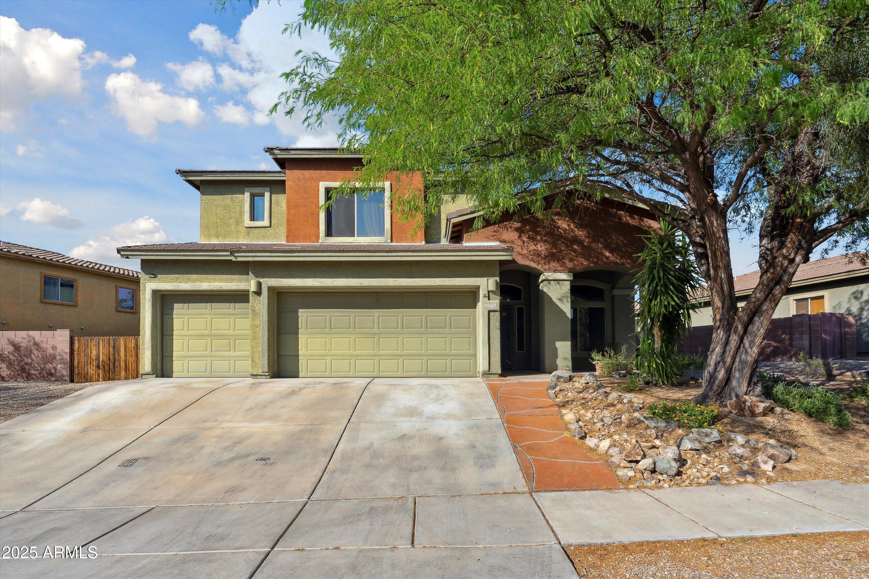 17407 South Purple Mesa Trail Vail, AZ 85641 - Photo 1 of 54 a front view of a house with a yard and potted plants