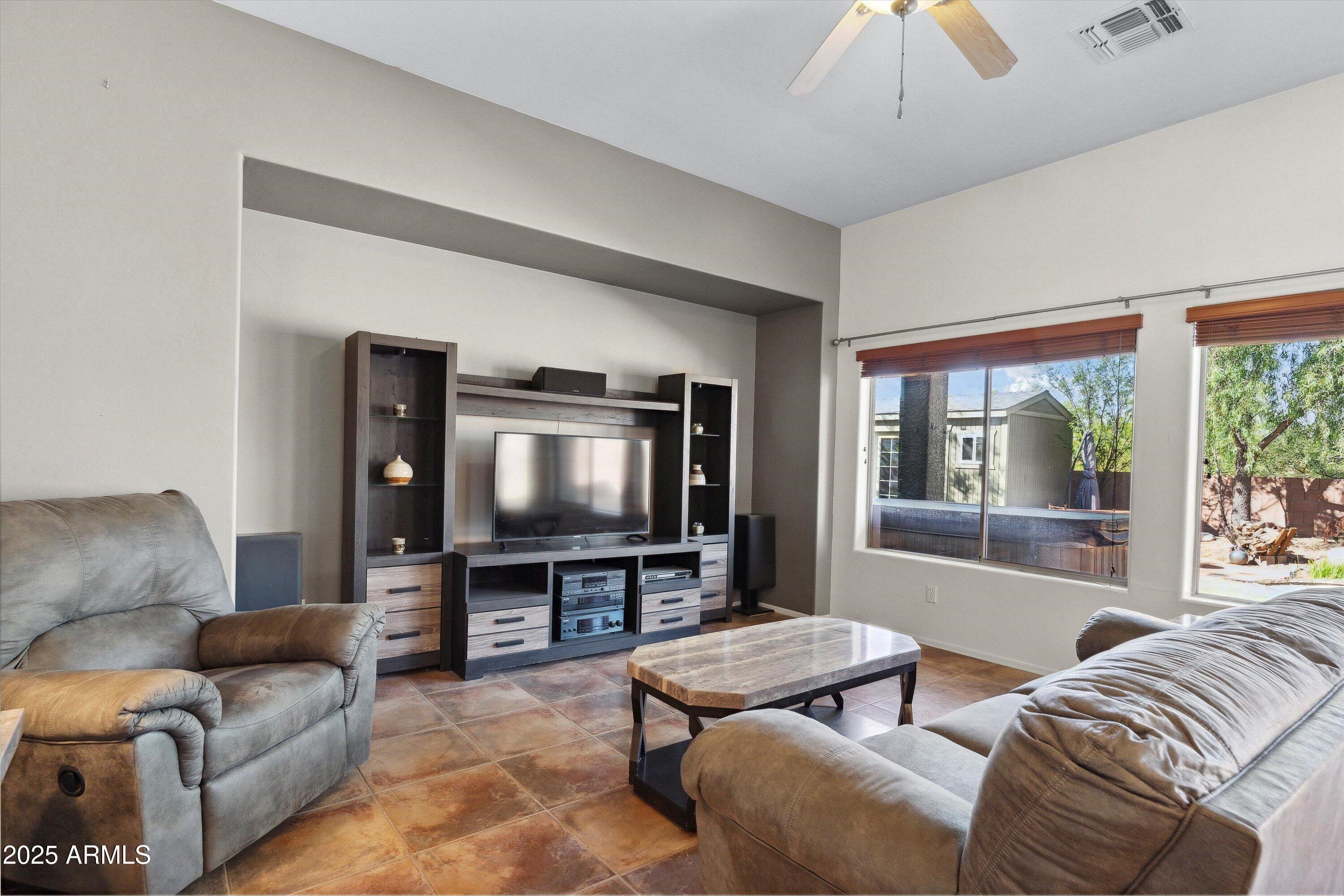 17407 South Purple Mesa Trail Vail, AZ 85641 - Photo 10 of 54 a living room with furniture and a flat screen tv