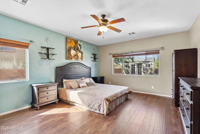 a bedroom with a large bed and a window