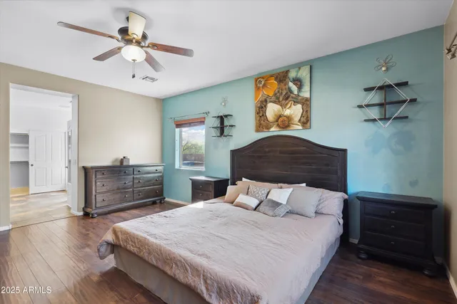 a bedroom with a bed and a dresser