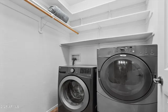 a utility room with dryer and washer