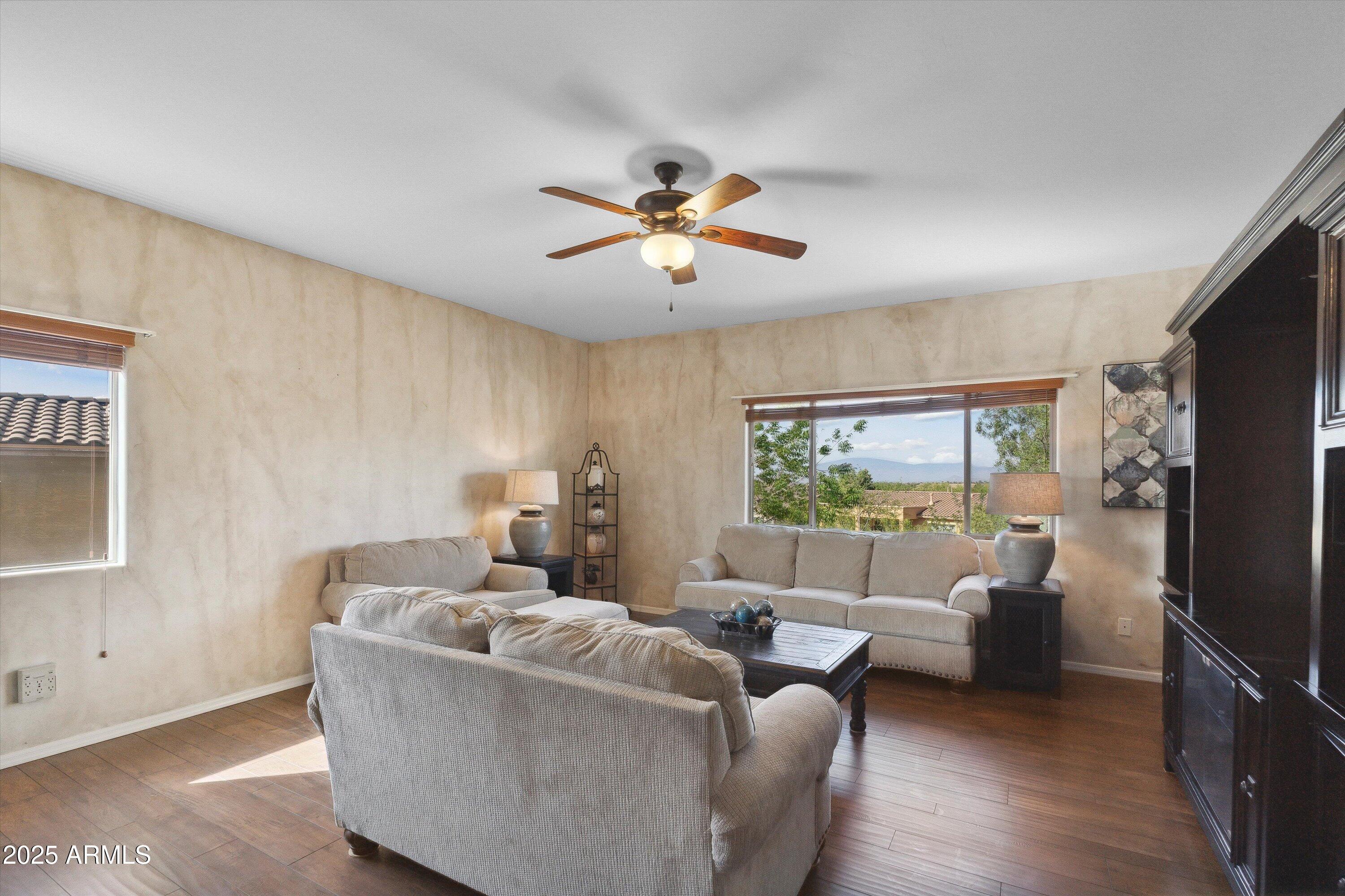 17407 South Purple Mesa Trail Vail, AZ 85641 - Photo 26 of 54 a living room with furniture and a flat screen tv