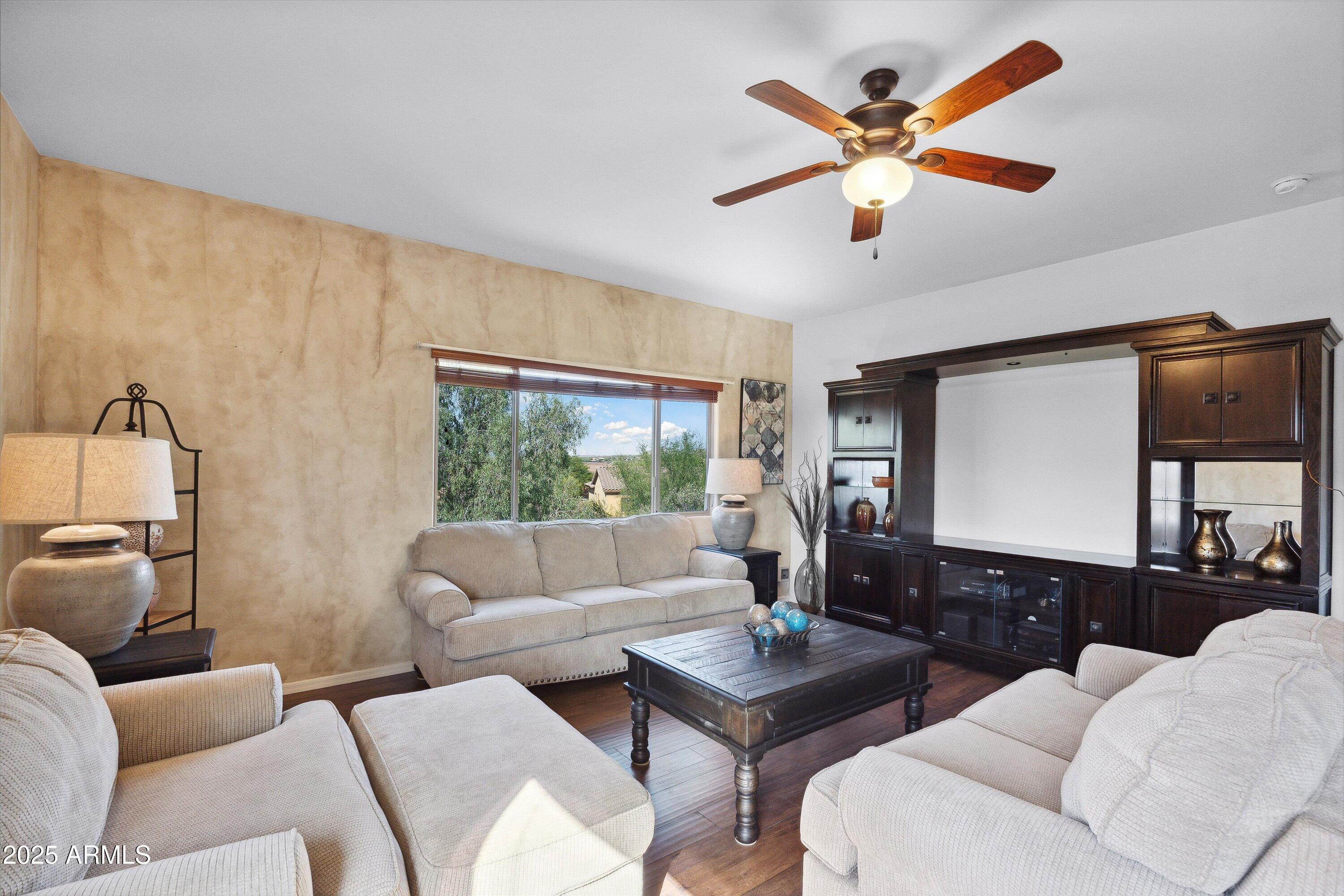 17407 South Purple Mesa Trail Vail, AZ 85641 - Photo 27 of 54 a living room with furniture and a large window