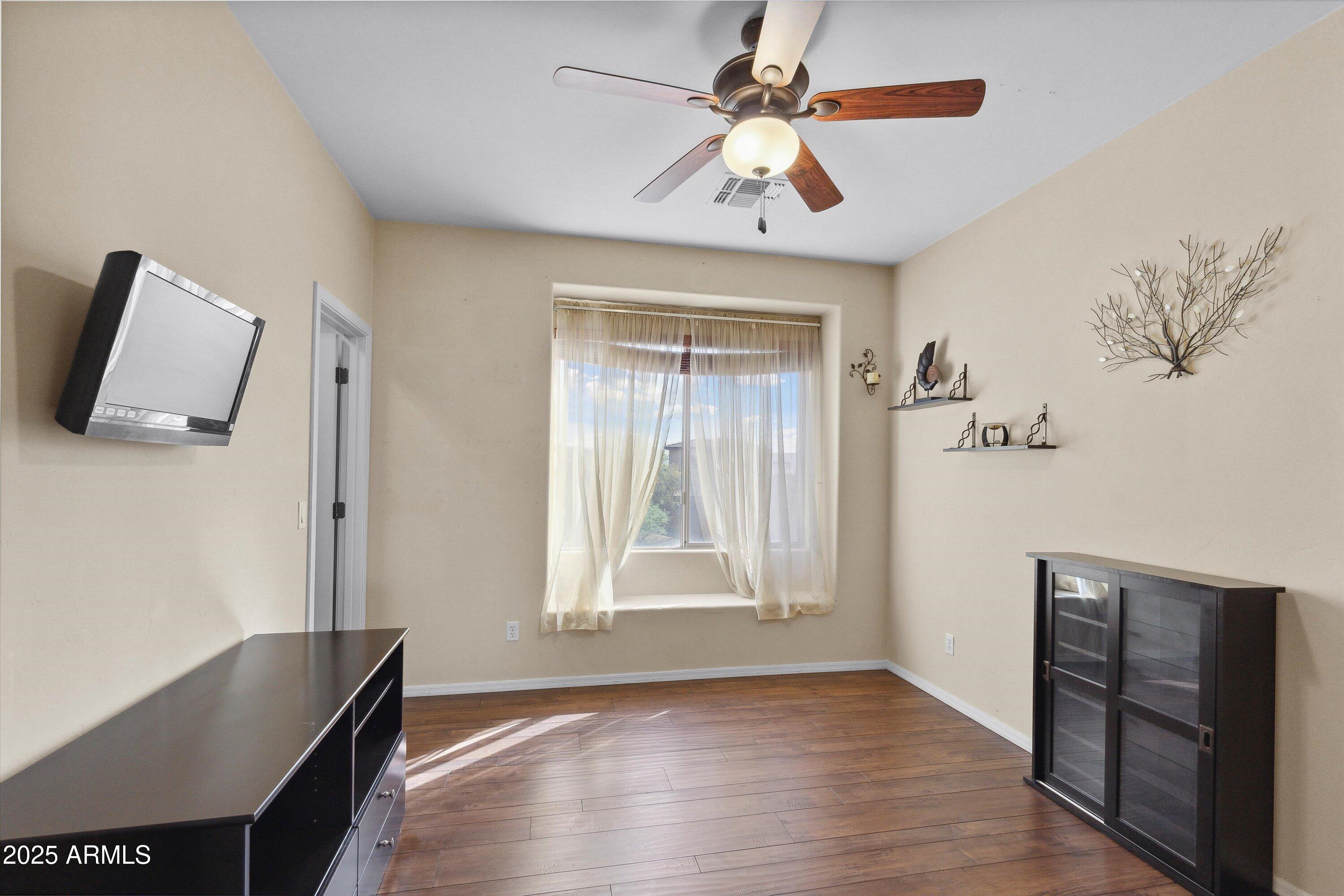 17407 South Purple Mesa Trail Vail, AZ 85641 - Photo 28 of 54 a view of room with window and wooden floor