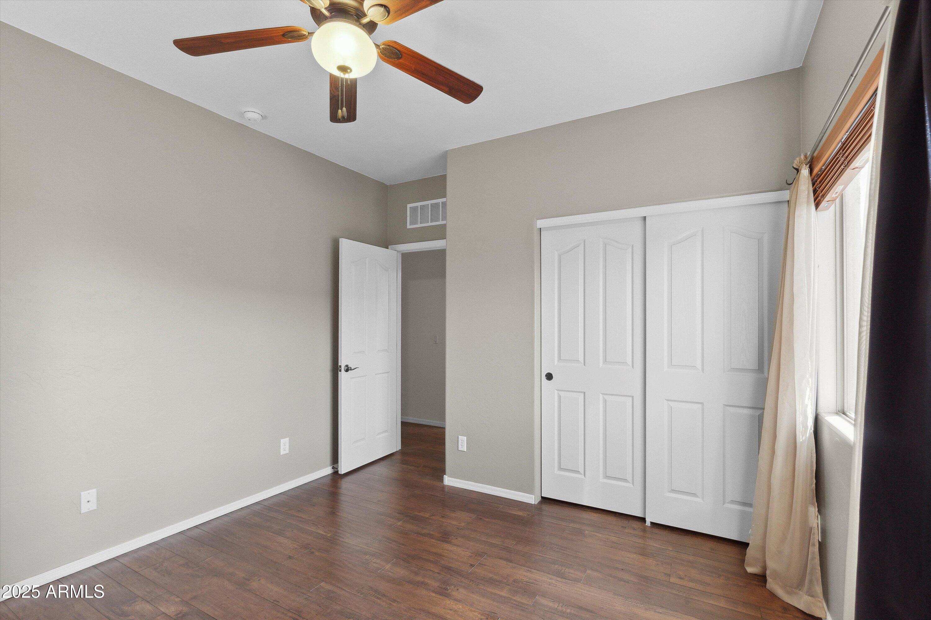 17407 South Purple Mesa Trail Vail, AZ 85641 - Photo 31 of 54 wooden floor in an empty room with a window