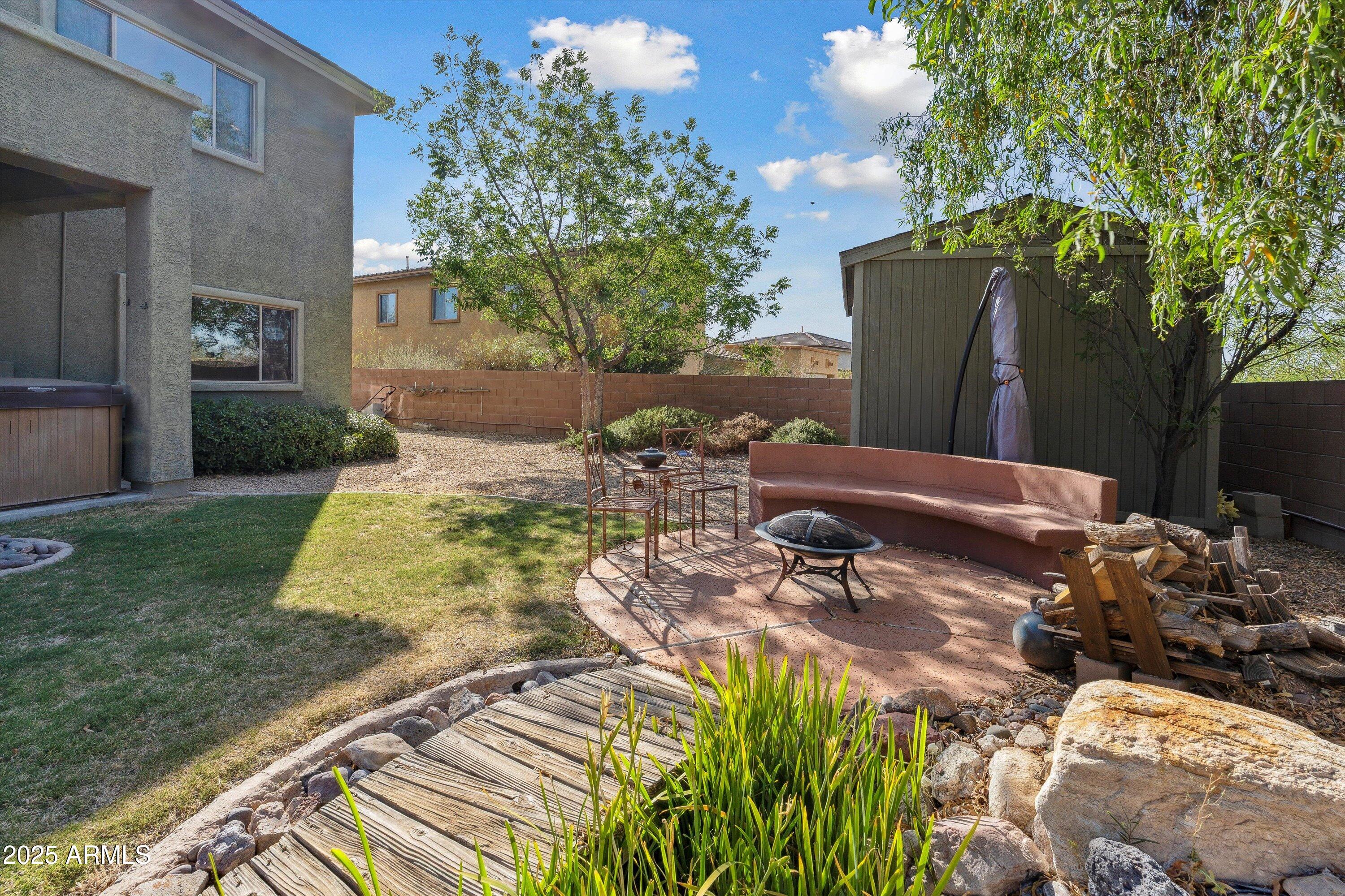 17407 South Purple Mesa Trail Vail, AZ 85641 - Photo 37 of 54 a backyard of a house with table and chairs