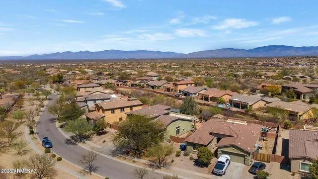 a view of a town with mountains in the background