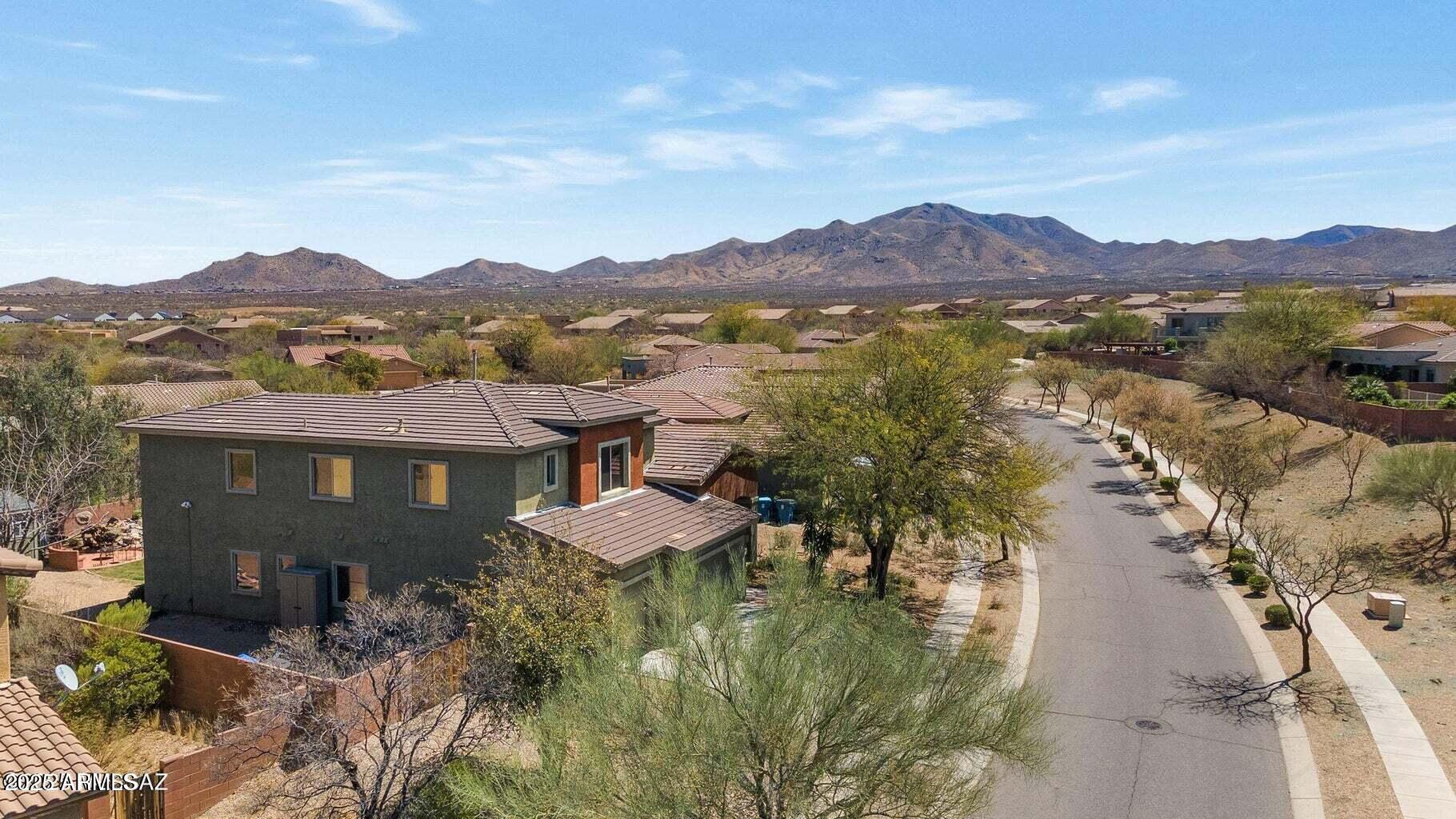 17407 South Purple Mesa Trail Vail, AZ 85641 - Photo 42 of 54 a view of a town with mountains in the background