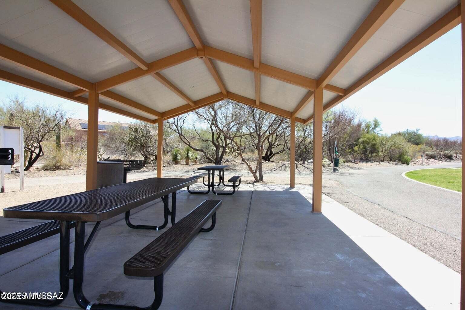 17407 South Purple Mesa Trail Vail, AZ 85641 - Photo 49 of 54 a view of a porch with furniture and a yard