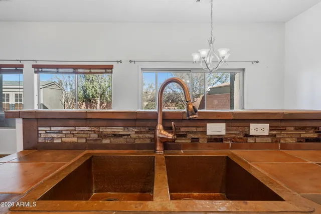 a view of a room with wooden floor and stairs