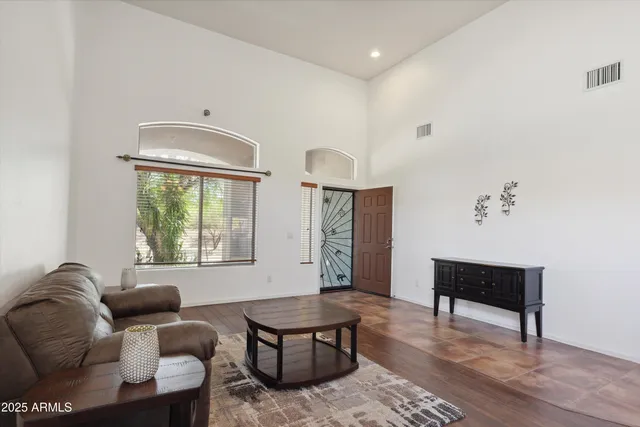 a kitchen with stainless steel appliances granite countertop a refrigerator stove and sink