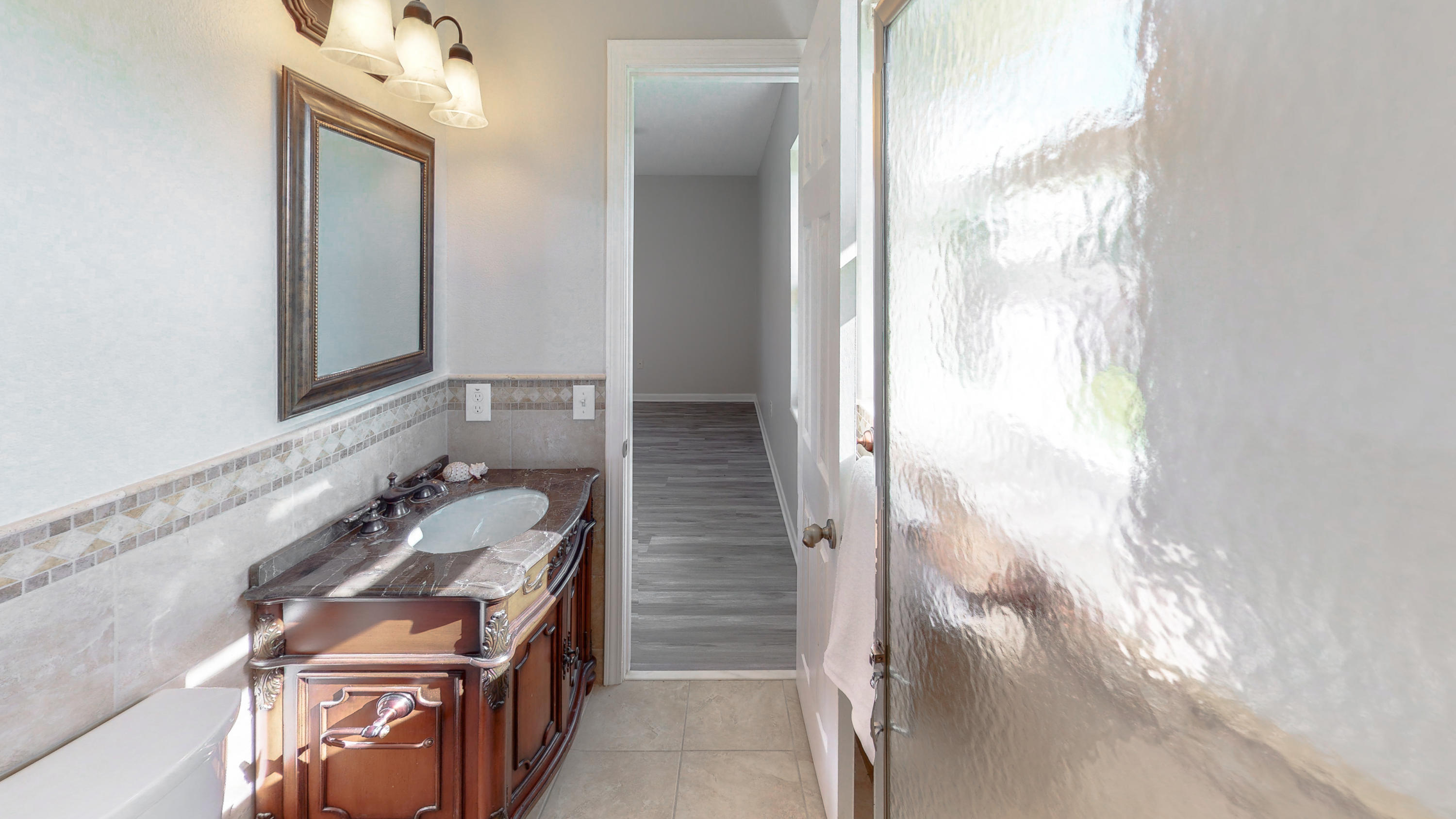 321 Echo Circle Fort Walton Beach, FL 32548 - Photo 16 of 35 a bathroom with a sink and a mirror