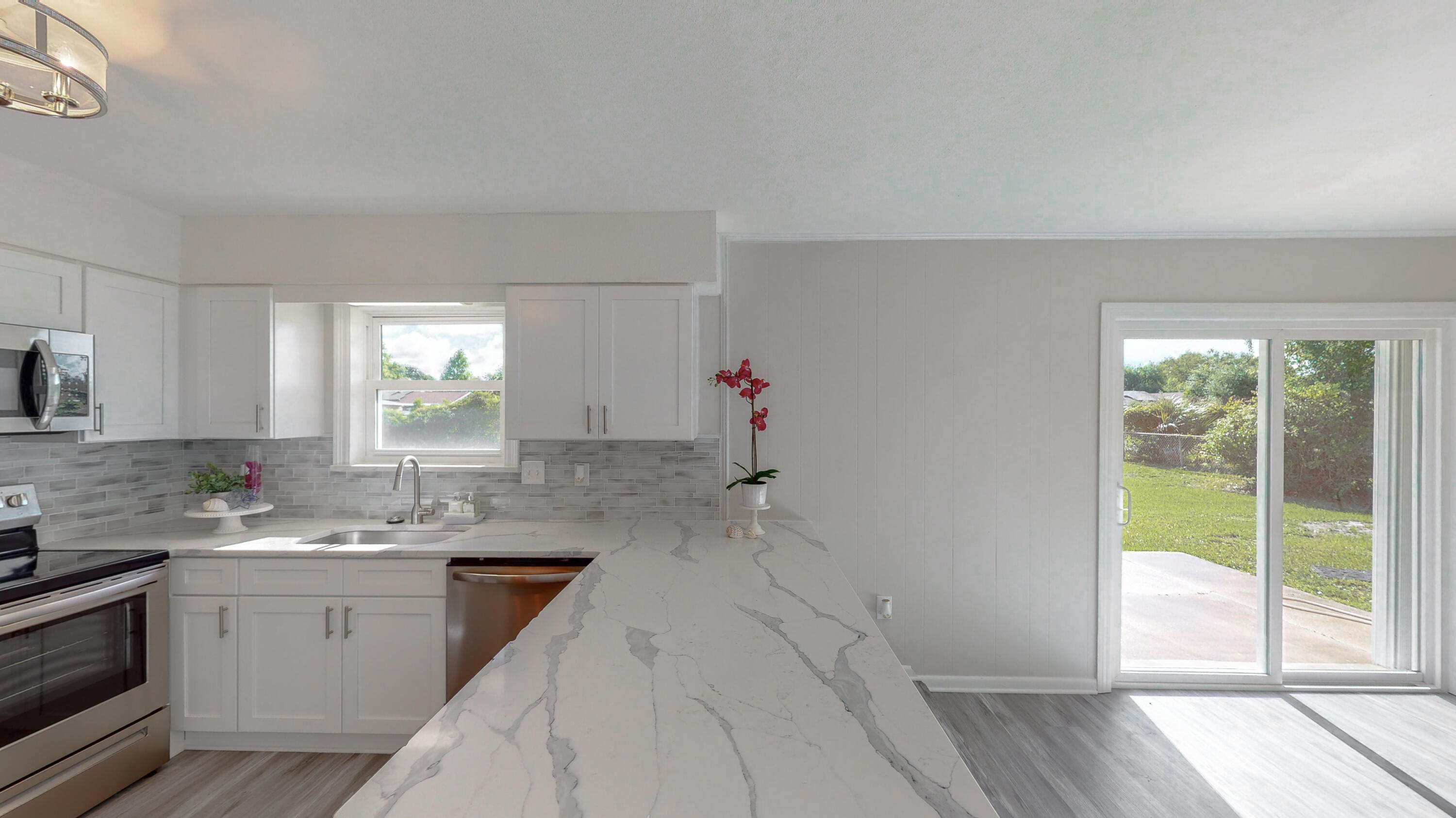 321 Echo Circle Fort Walton Beach, FL 32548 - Photo 8 of 35 a kitchen with a sink cabinets and window