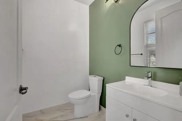 a bathroom with a sink and a toilet
