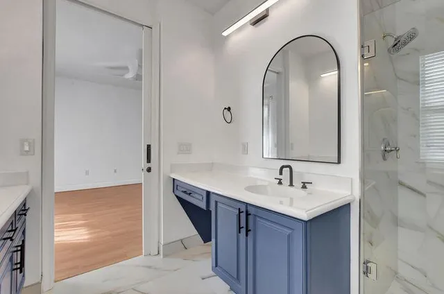 a bathroom with a sink and a mirror