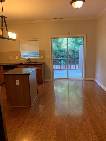 a kitchen with a stove a sink and a microwave