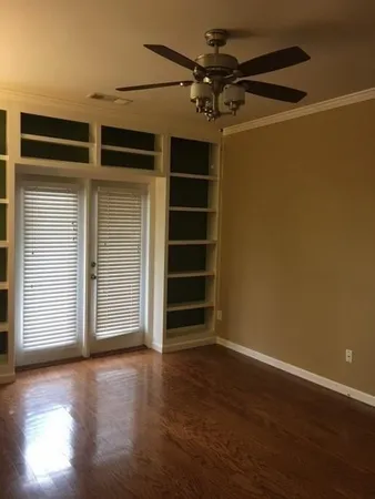 a view of room with window and cabinet