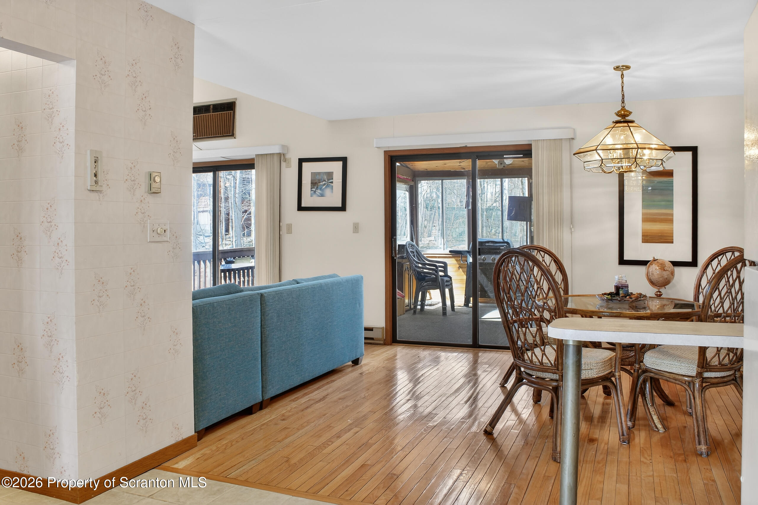 211 Falls Circle Bushkill, PA 18324 - Photo 6 of 28 a view of a livingroom with furniture window and wooden floor