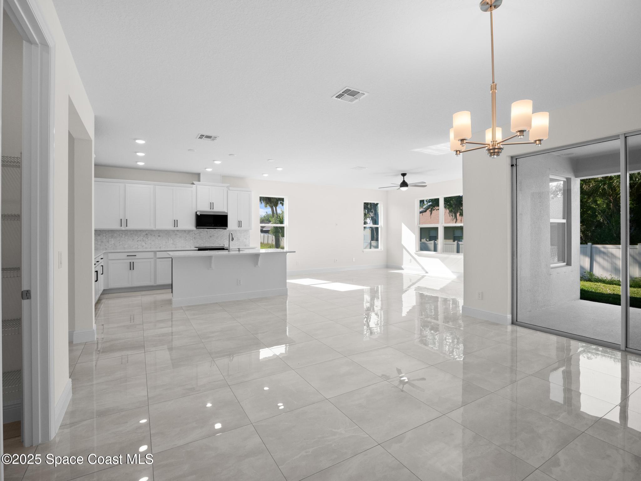 2112 Killian Drive Palm Bay, FL 32905 - Photo 11 of 19 a view of a living room and kitchen view