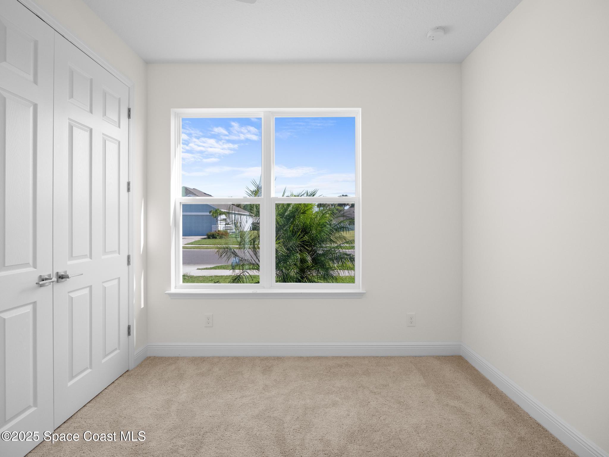 2112 Killian Drive Palm Bay, FL 32905 - Photo 17 of 19 an empty room with a window