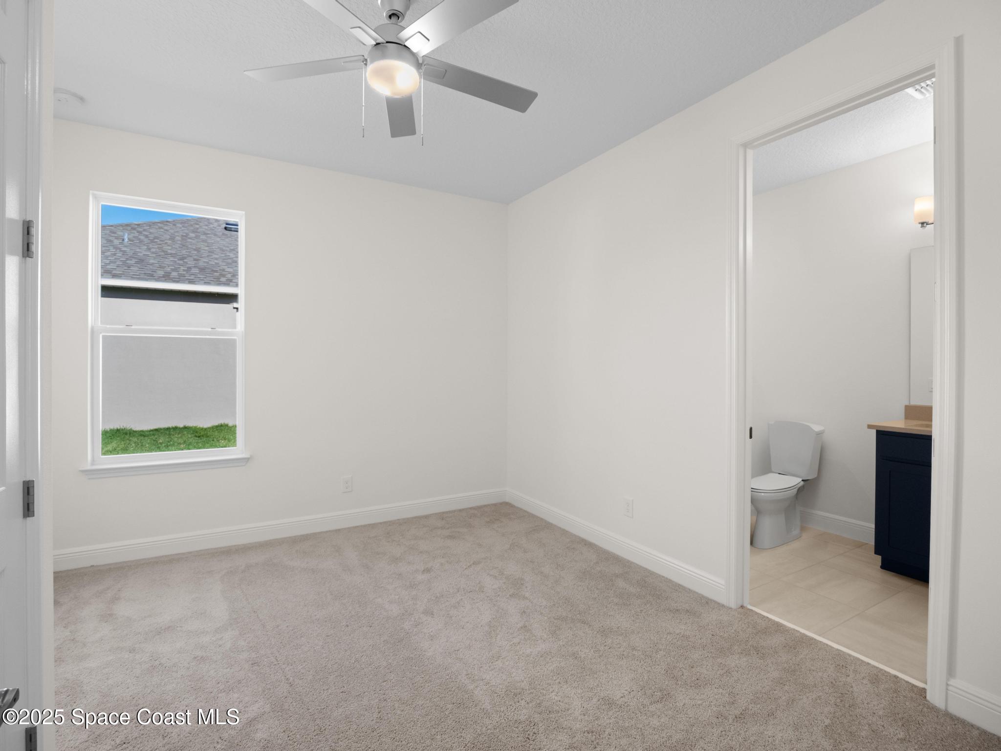 2112 Killian Drive Palm Bay, FL 32905 - Photo 6 of 19 a view of an empty room with a window