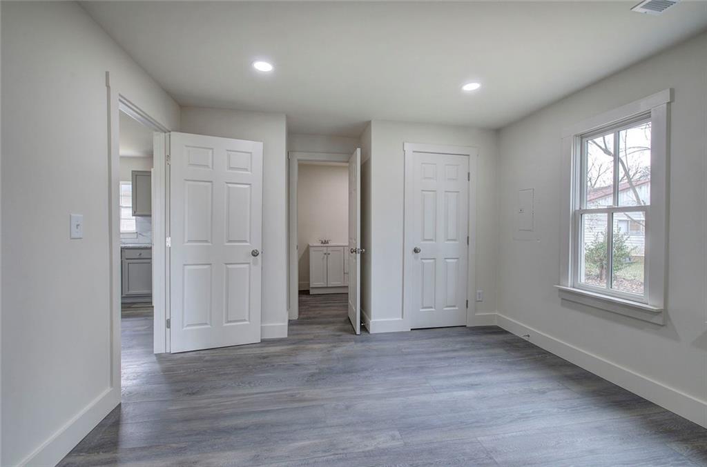 30 Grove Circle Cartersville, GA 30120 - Photo 16 of 33 an empty room with wooden floor and windows