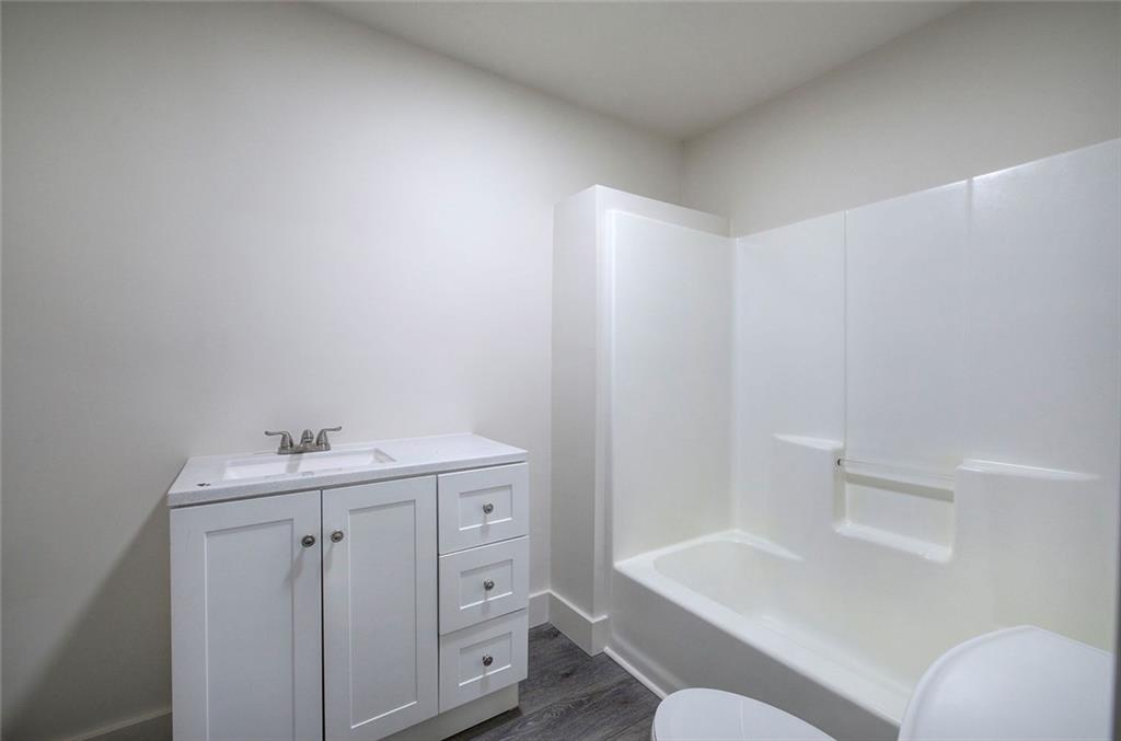 30 Grove Circle Cartersville, GA 30120 - Photo 18 of 33 a bathroom with a sink toilet vanity and tub