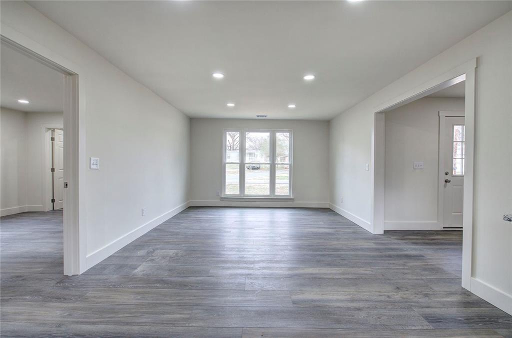30 Grove Circle Cartersville, GA 30120 - Photo 28 of 33 a view of an empty room with wooden floor and a window