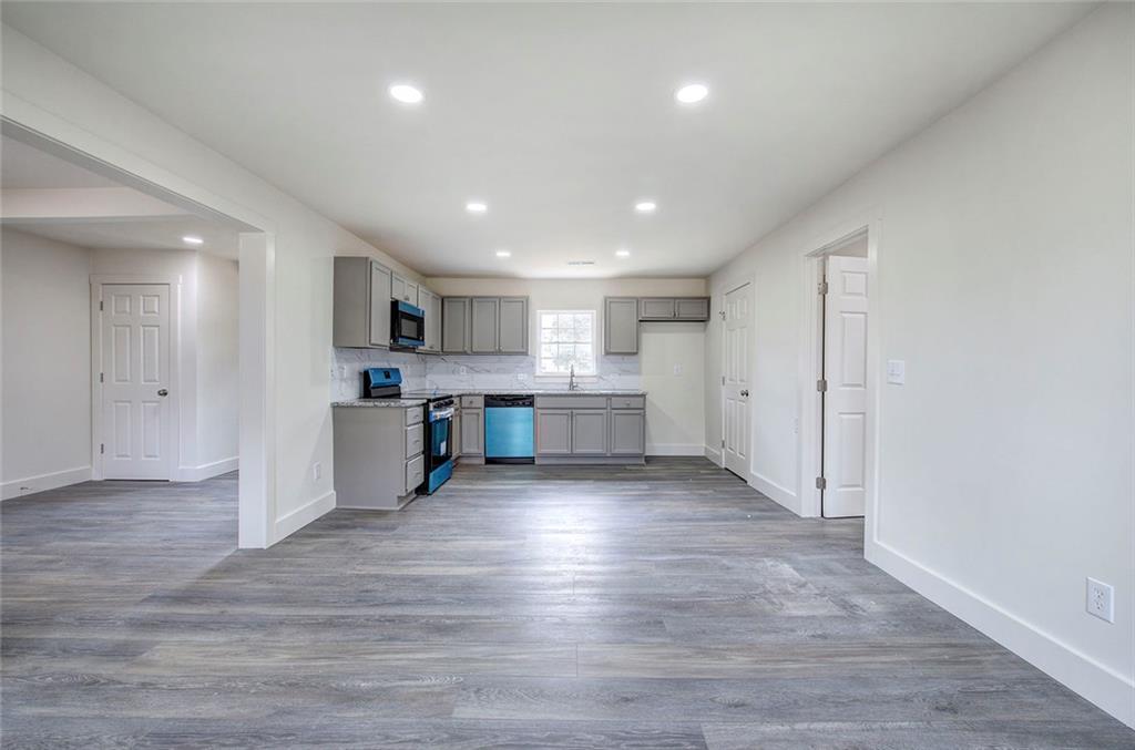 30 Grove Circle Cartersville, GA 30120 - Photo 29 of 33 a view of a kitchen with a sink and wooden cabinets