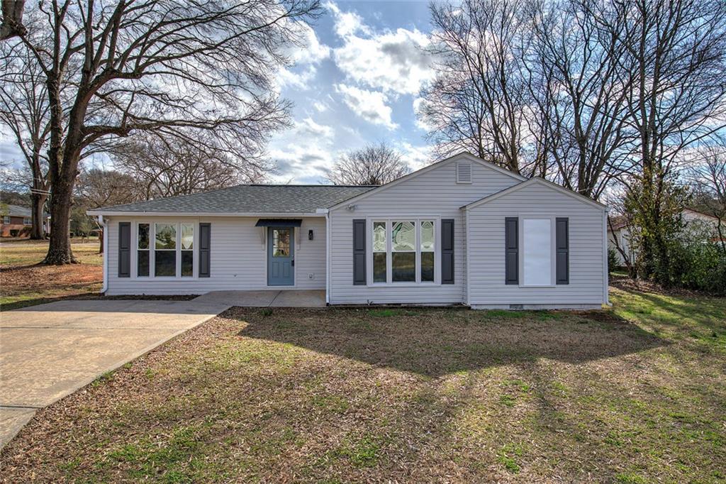 30 Grove Circle Cartersville, GA 30120 - Photo 3 of 33 a front view of a house with a garden