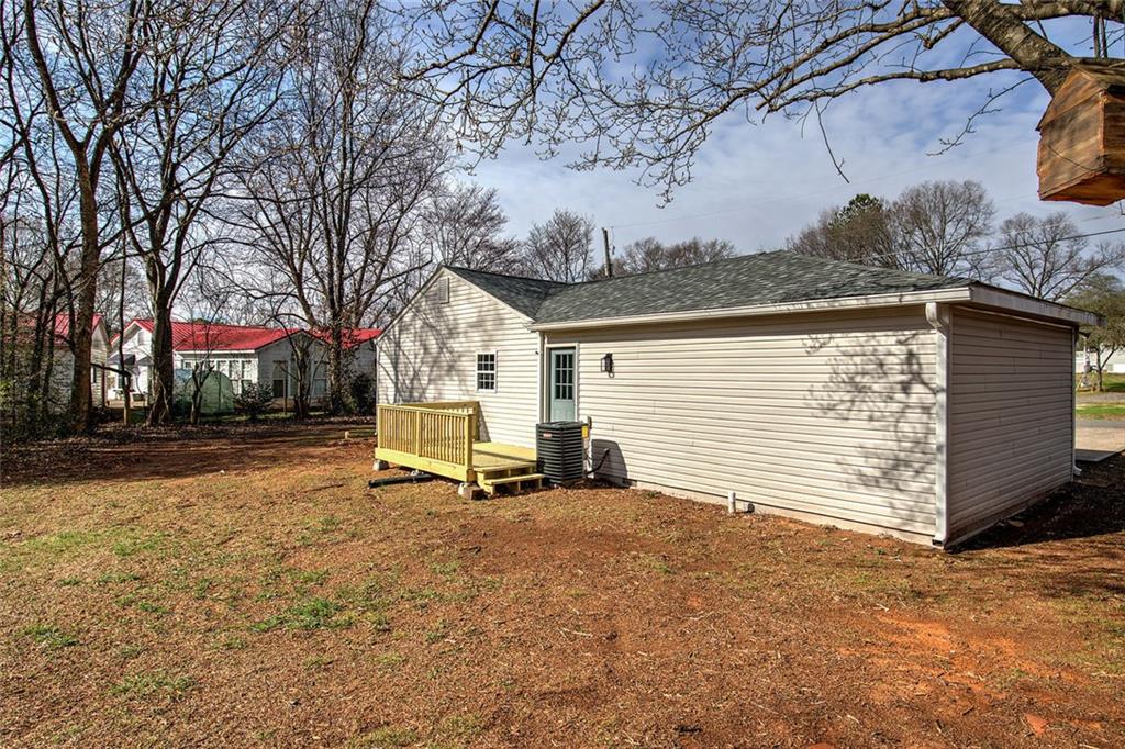 30 Grove Circle Cartersville, GA 30120 - Photo 31 of 33 a view of a backyard with a bench