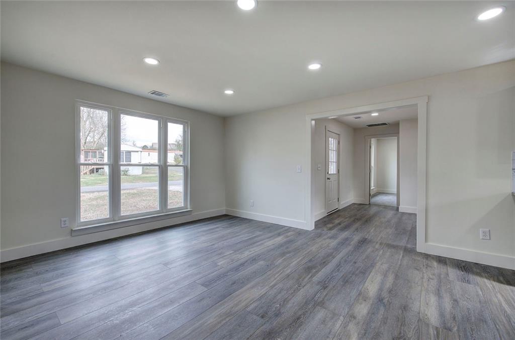 30 Grove Circle Cartersville, GA 30120 - Photo 9 of 33 an empty room with wooden floor and windows