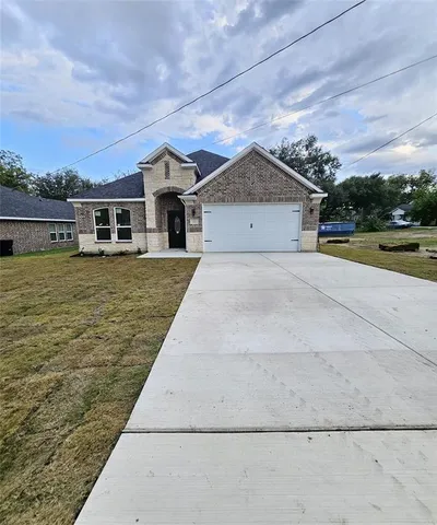 a house with trees in the background