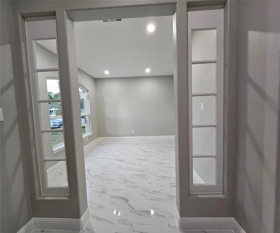 a view of hallway with livingroom