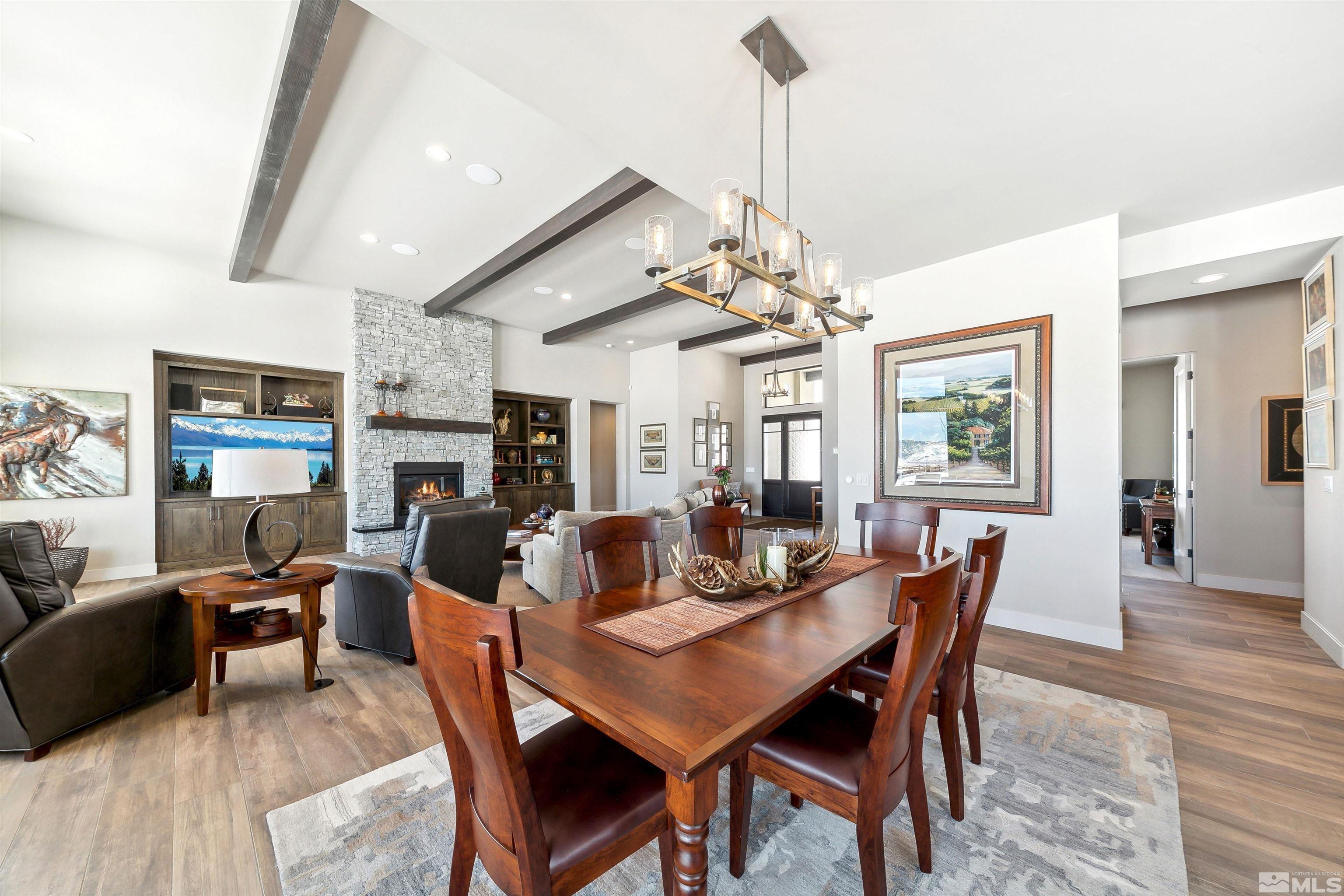 4110 Spotted Eagle Court Reno, NV 89511 - Photo 15 of 40 a view of a dining room with furniture wooden floor and chandelier