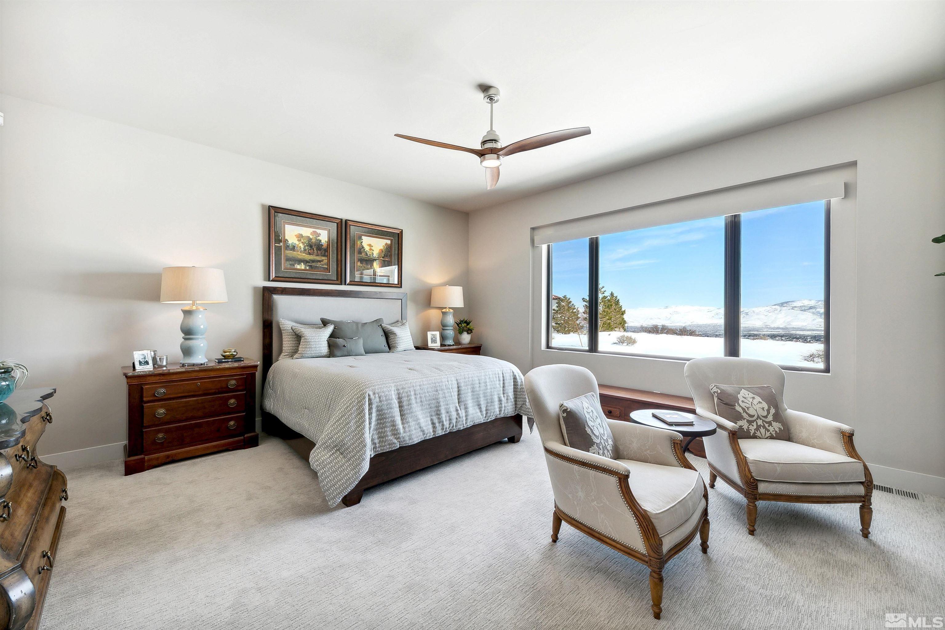 4110 Spotted Eagle Court Reno, NV 89511 - Photo 16 of 40 a bedroom with a bed and a couch