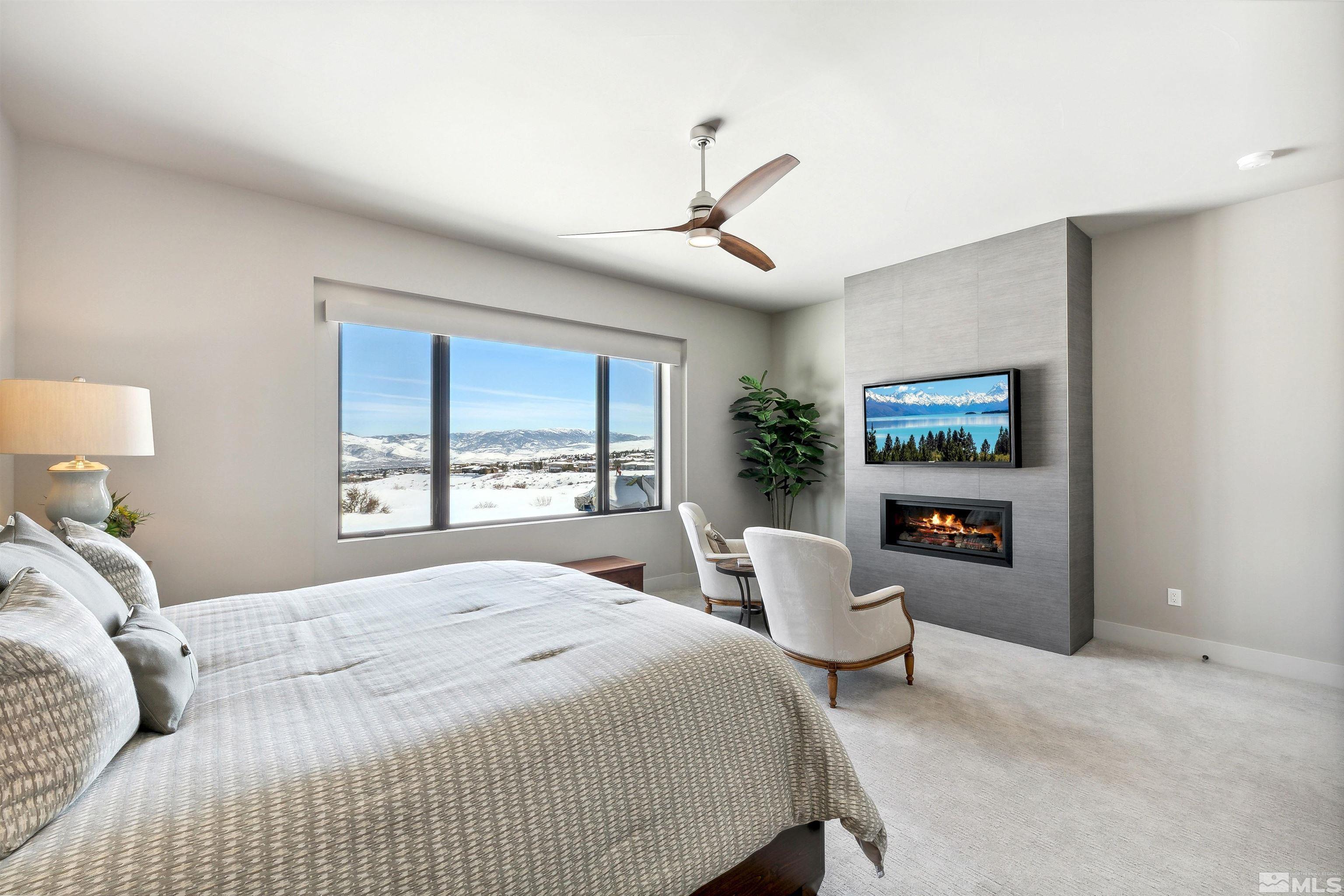 4110 Spotted Eagle Court Reno, NV 89511 - Photo 17 of 40 a bedroom with a balcony a bed and a painting on the wall