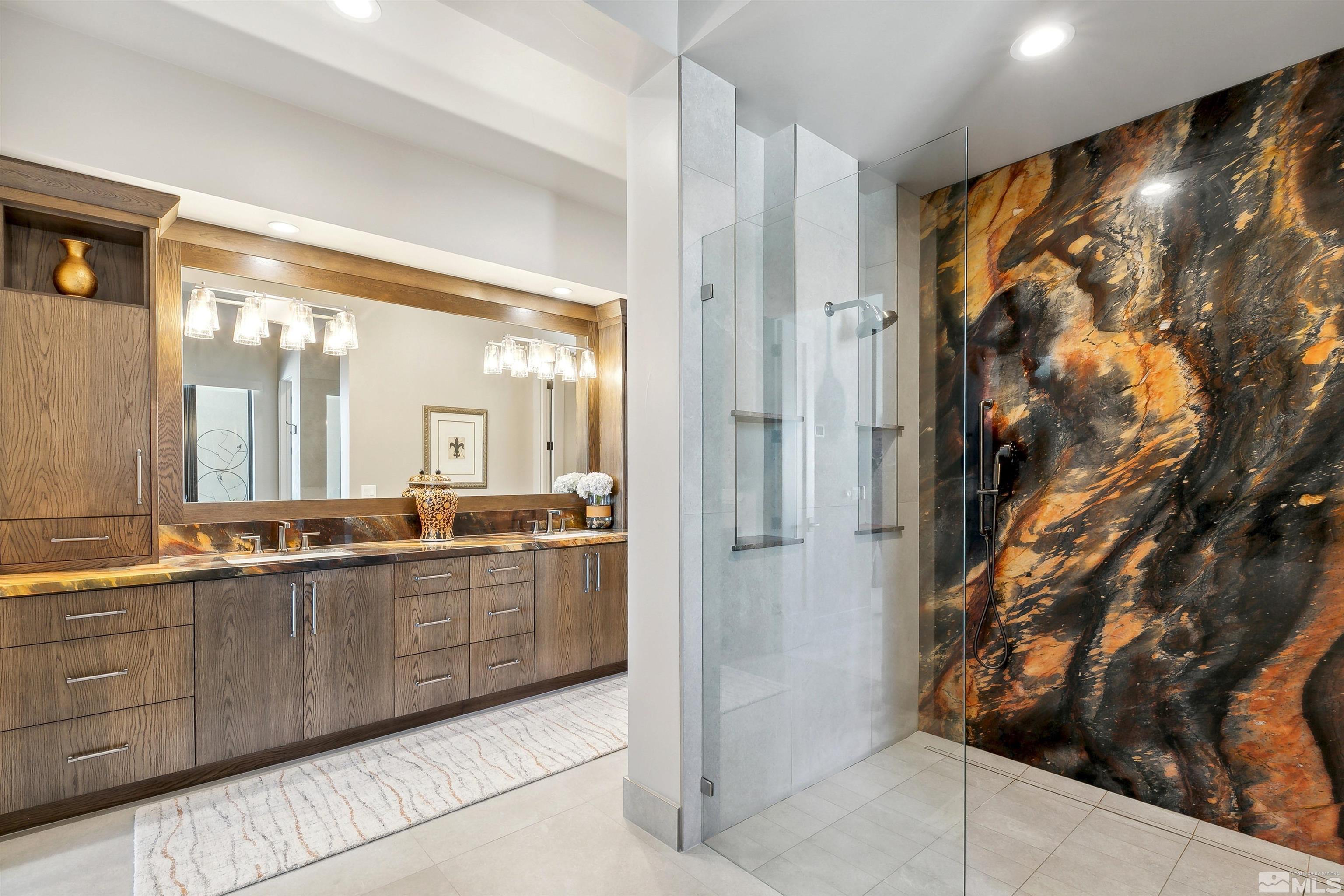 4110 Spotted Eagle Court Reno, NV 89511 - Photo 19 of 40 a large bathroom with a double vanity sink and a mirror