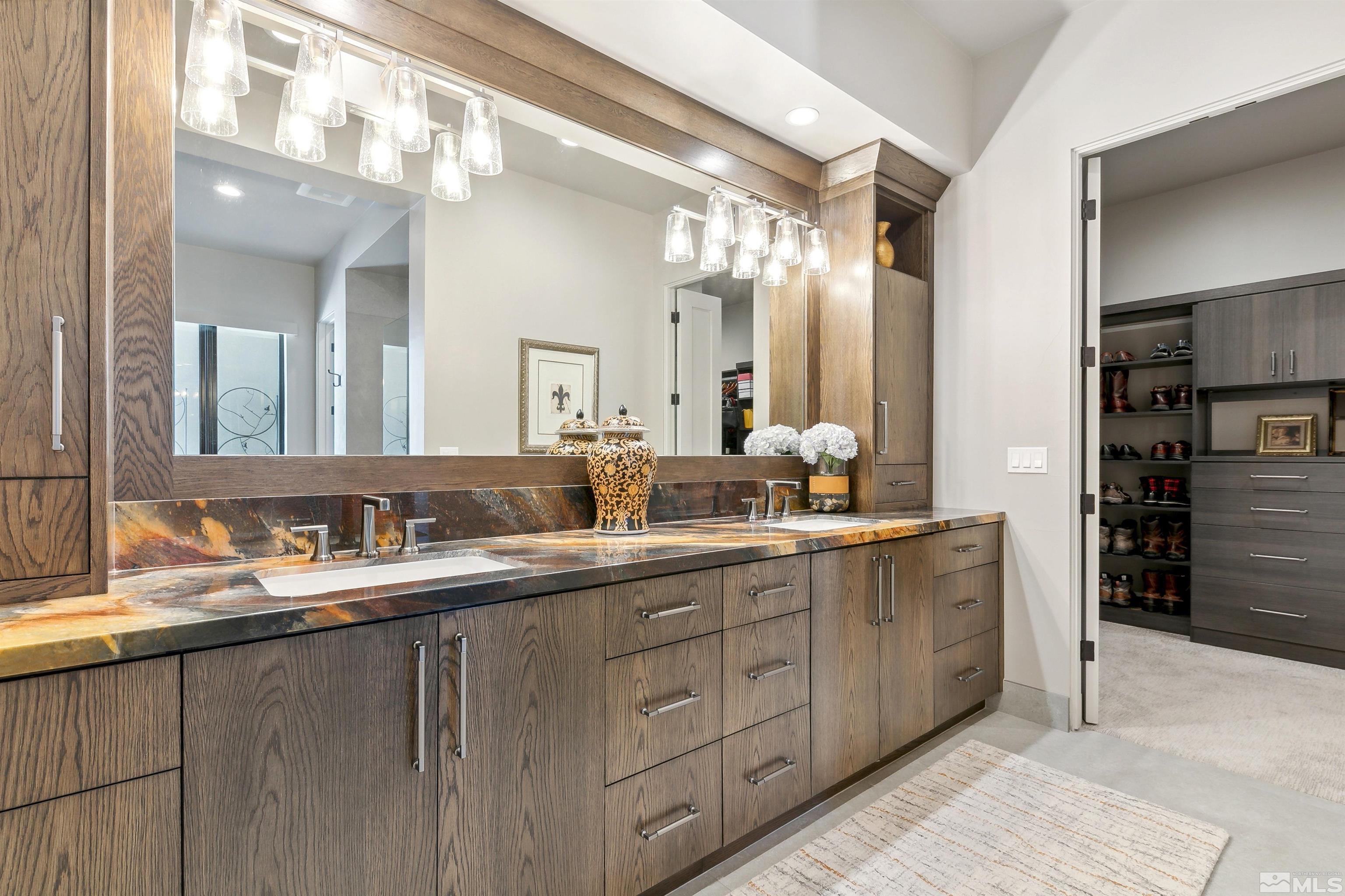4110 Spotted Eagle Court Reno, NV 89511 - Photo 20 of 40 a bathroom with a double vanity sink and a mirror