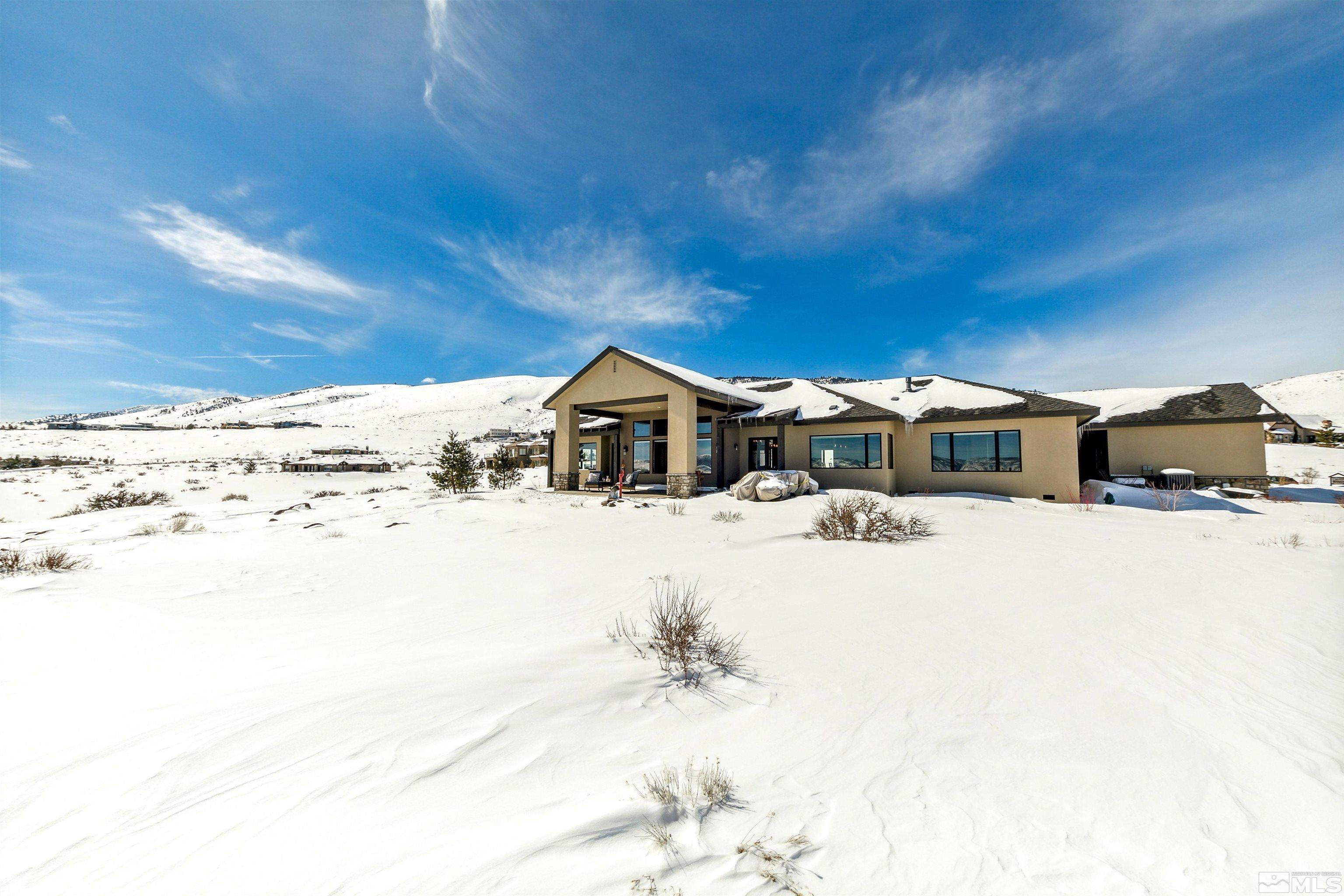 4110 Spotted Eagle Court Reno, NV 89511 - Photo 2 of 40 a front view of a house with a yard